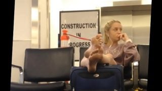 Voyeur teen feet waiting at airport